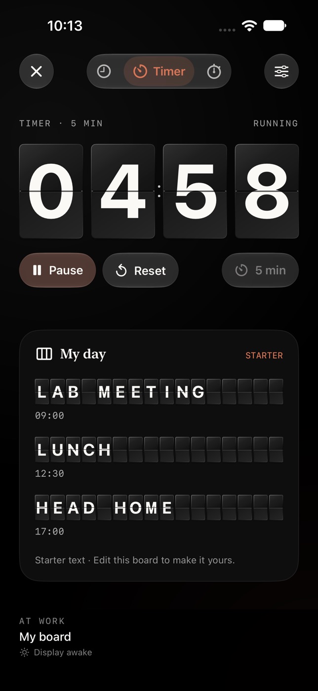 The At work display with the timer face selected. The flap tiles read 04:58 with Pause and Reset buttons beneath, above the My day board.